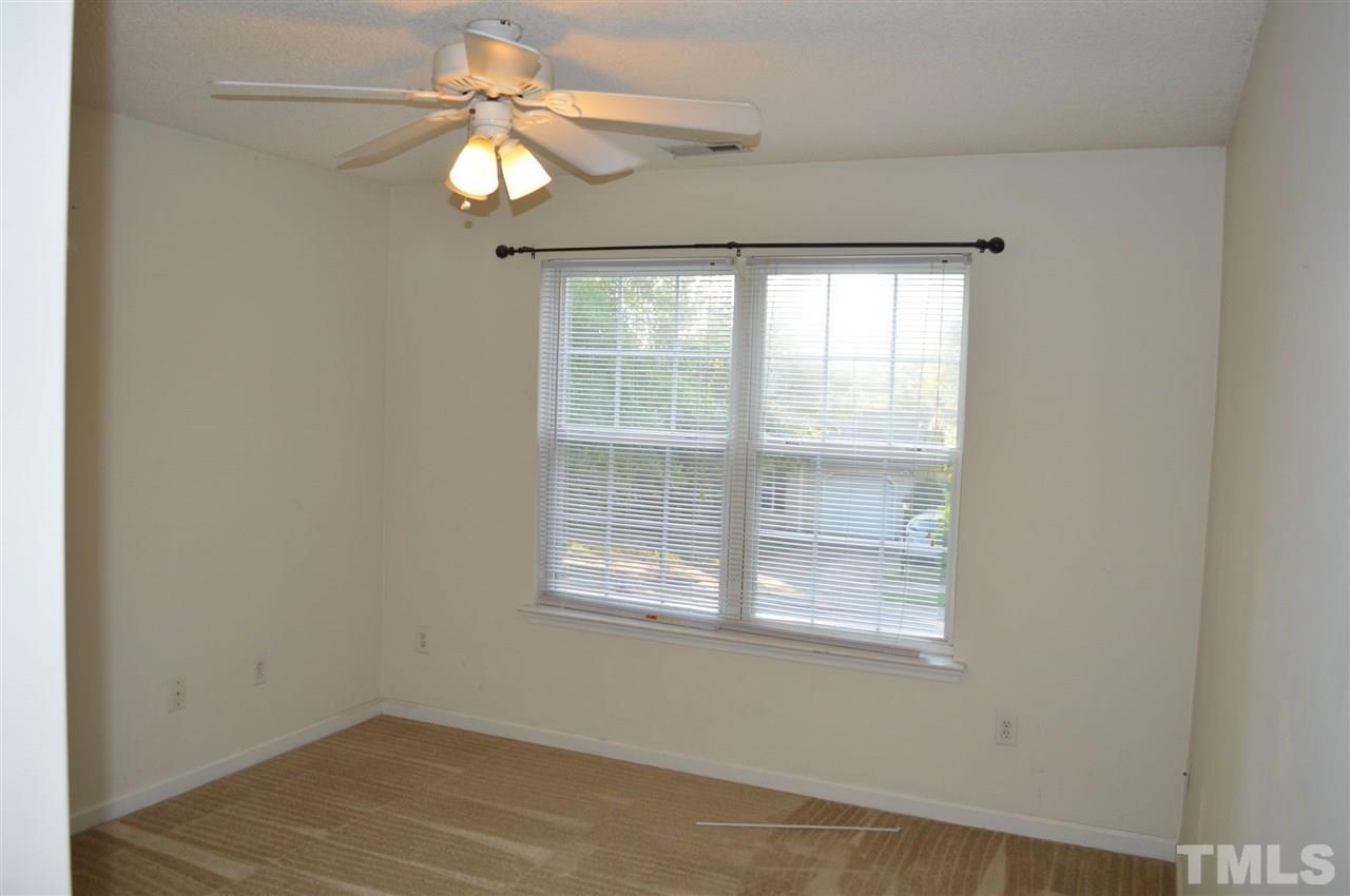 5116 Gable Ridge Drive Durham, NC 27713 - Photo 7 of 16 a view of a livingroom with a chandelier fan and a window