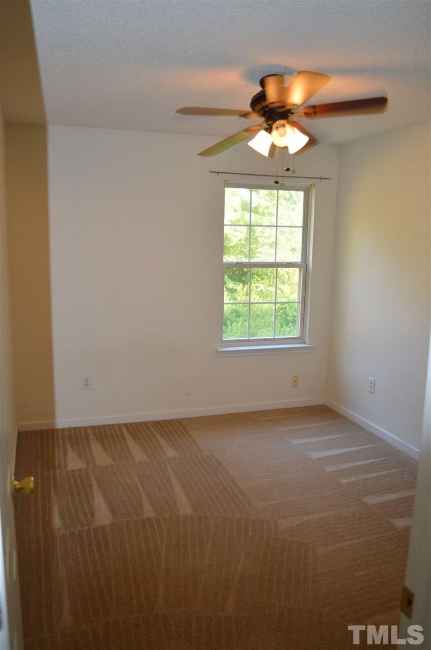 5116 Gable Ridge Drive Durham, NC 27713 - Photo 8 of 16 an empty room with a window