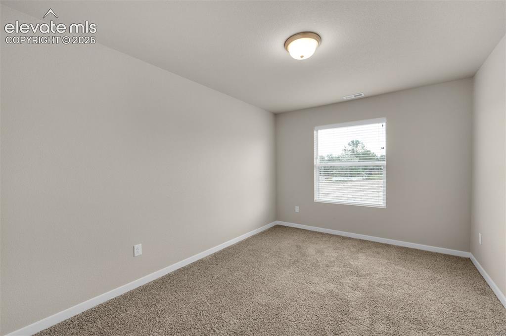 6644 Rawhide Rdg View Colorado Springs, CO 80915 - Photo 15 of 26 an empty room with a window