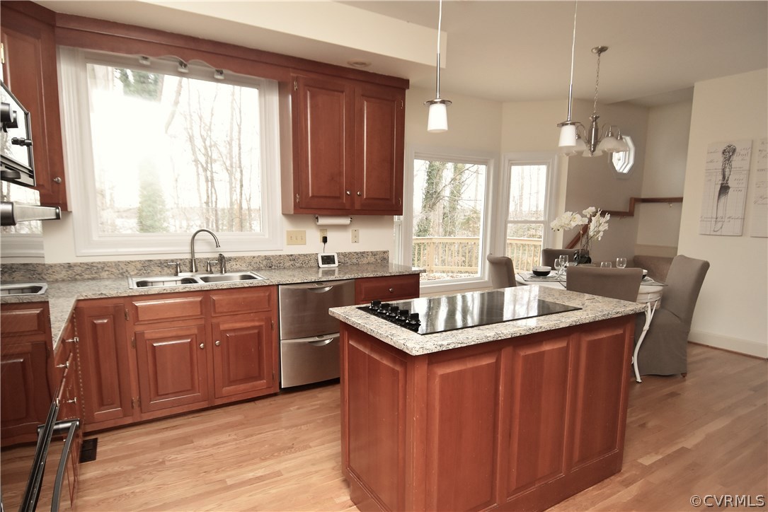 13806 Beechwood Point Road Midlothian, VA 23112 - Photo 20 of 48 a kitchen with stainless steel appliances granite countertop a sink a stove a counter space and a large window