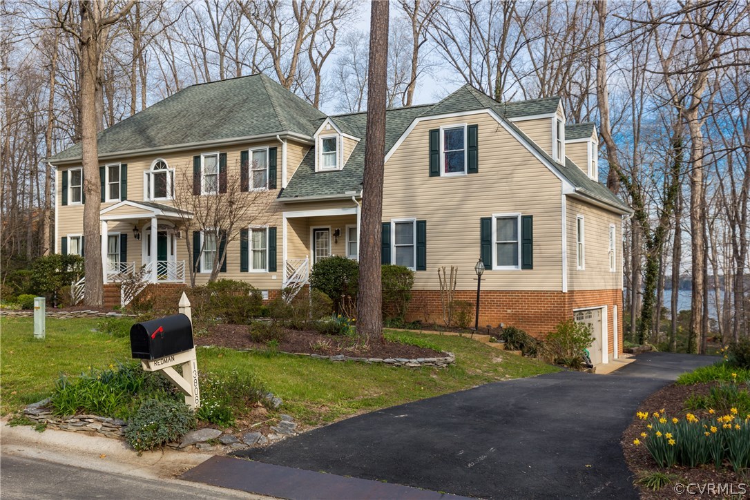 13806 Beechwood Point Road Midlothian, VA 23112 - Photo 2 of 48 a front view of a house with a yard