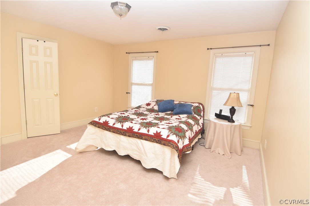 13806 Beechwood Point Road Midlothian, VA 23112 - Photo 36 of 48 a bedroom with a bed and a window