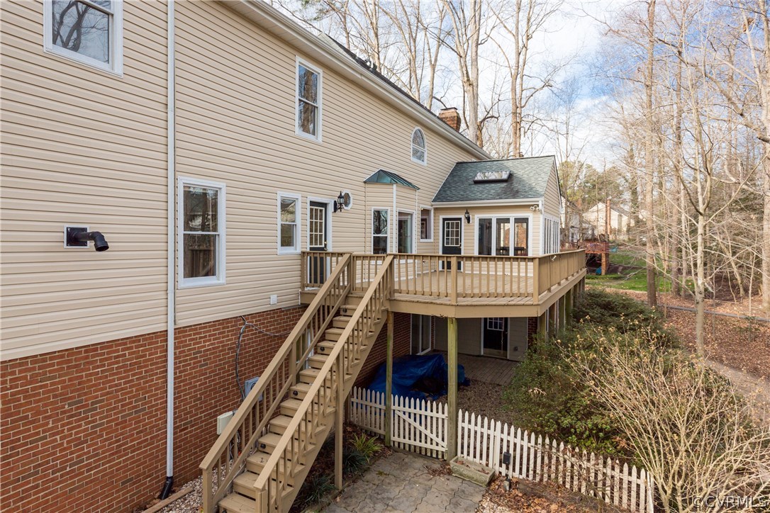 13806 Beechwood Point Road Midlothian, VA 23112 - Photo 4 of 48 a front view of a house with balcony and outdoor seating