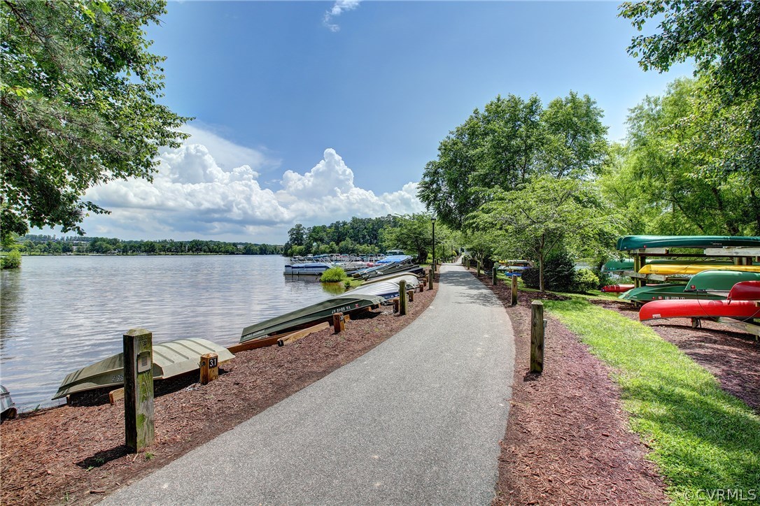 13806 Beechwood Point Road Midlothian, VA 23112 - Photo 41 of 48 a view of a lake with a yard