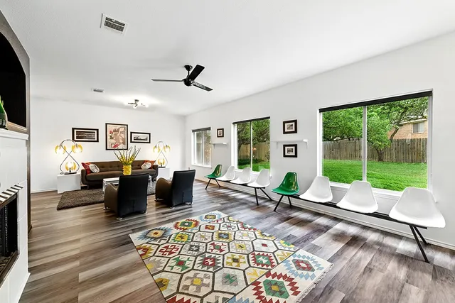 a living room with furniture or couch and a floor to ceiling window