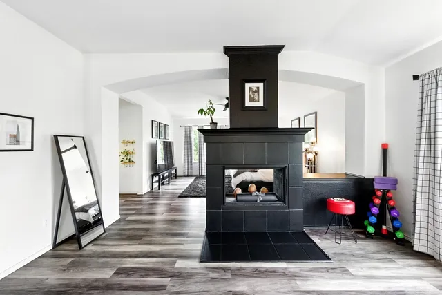 a living room with furniture and a fireplace