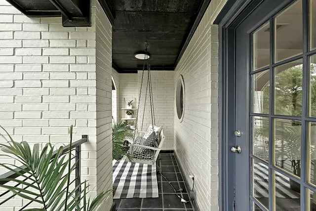 a view of balcony with furniture