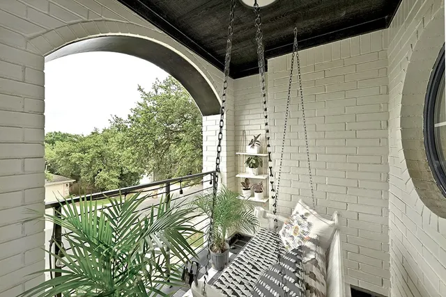 a view of balcony with furniture