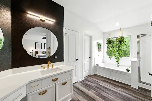 a bathroom with a sink and a mirror