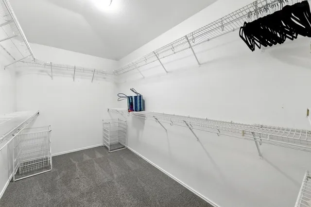 a view of a room with racks on the wall