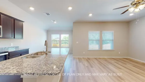 a view of a kitchen and living room