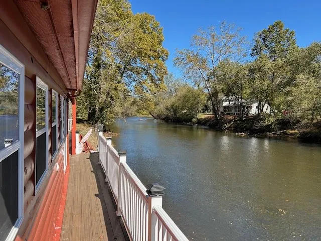 a view of balcony and yard