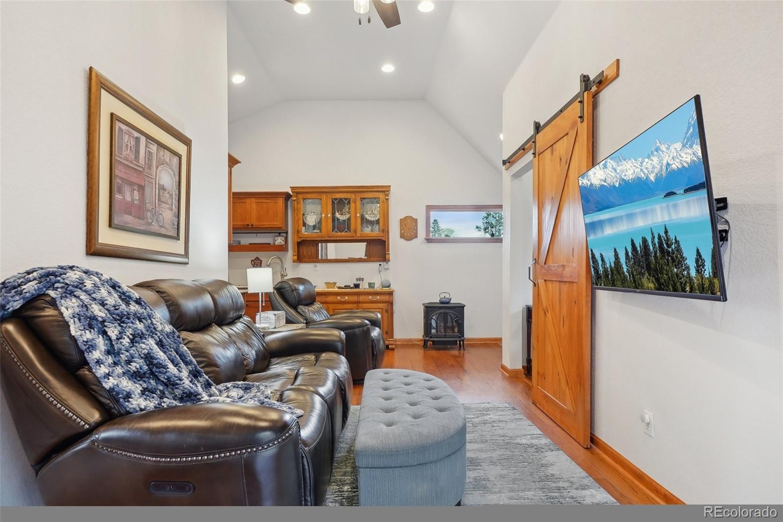 125 Aspen Road Black Hawk, CO 80422 - Photo 33 of 44 a living room with furniture and a painting on the wall