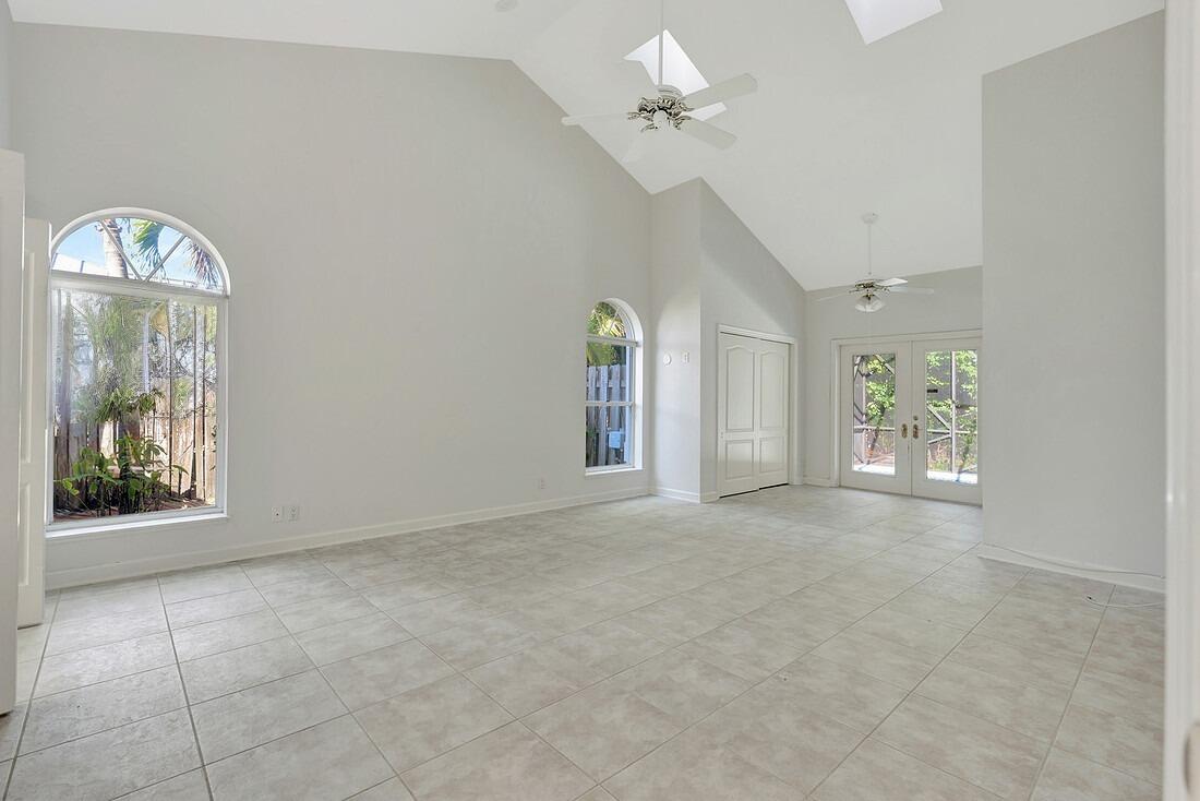 115 Olympus Way Jupiter, FL 33477 - Photo 17 of 44 a view of an empty room with a window