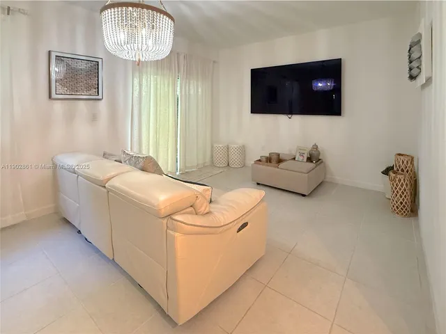 a room with furniture and a flat screen tv