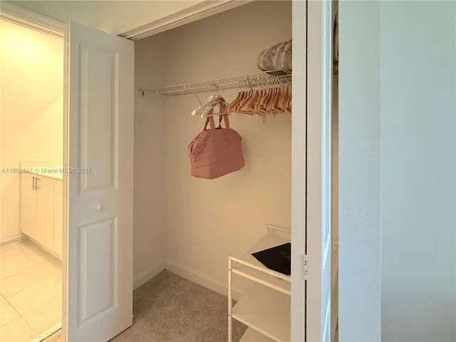 a bathroom with a toilet a sink and shower