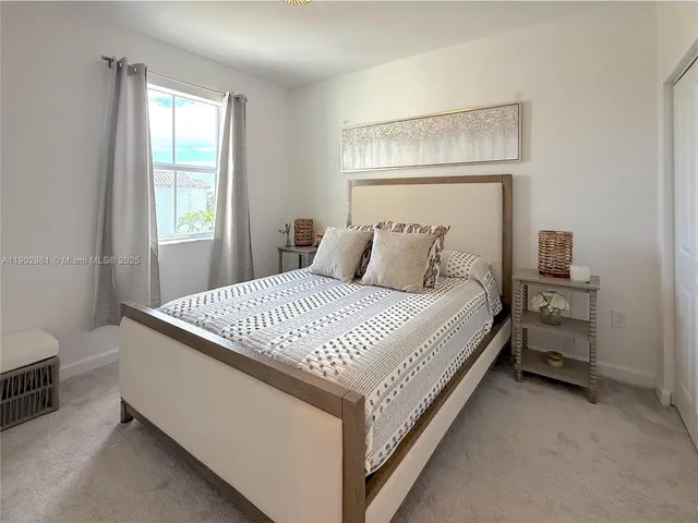 a bedroom with a bed and with furniture