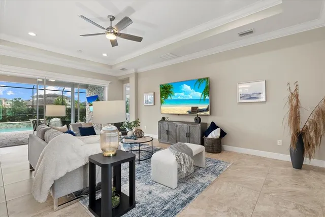 a living room with furniture a rug and a flat screen tv