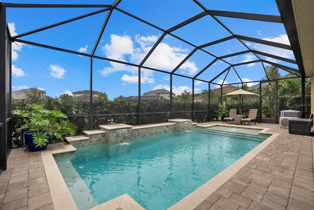 a view of a swimming pool with a patio