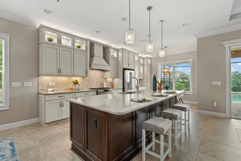 a kitchen with a sink stove and cabinets