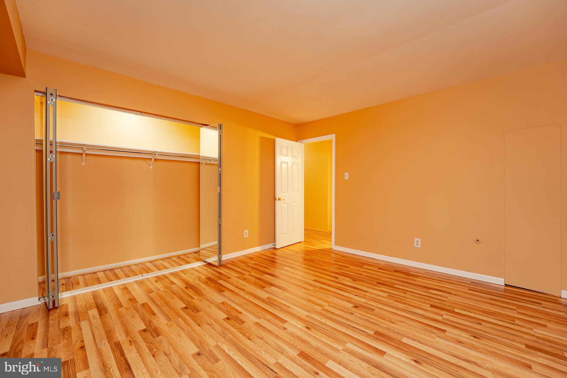 254 Vail Court, Unit 1504 Mays Landing, NJ 08330 - Photo 16 of 22 a view of an empty room with wooden floor