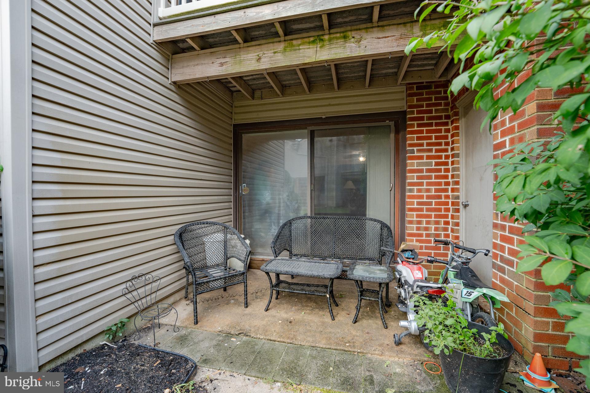 254 Vail Court, Unit 1504 Mays Landing, NJ 08330 - Photo 18 of 22 a front view of a house with outdoor seating