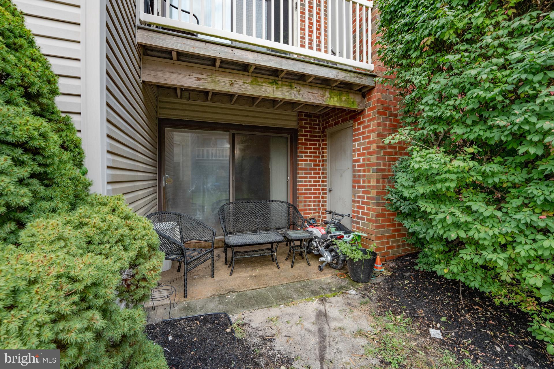 254 Vail Court, Unit 1504 Mays Landing, NJ 08330 - Photo 19 of 22 a view of a house with plants and chairs