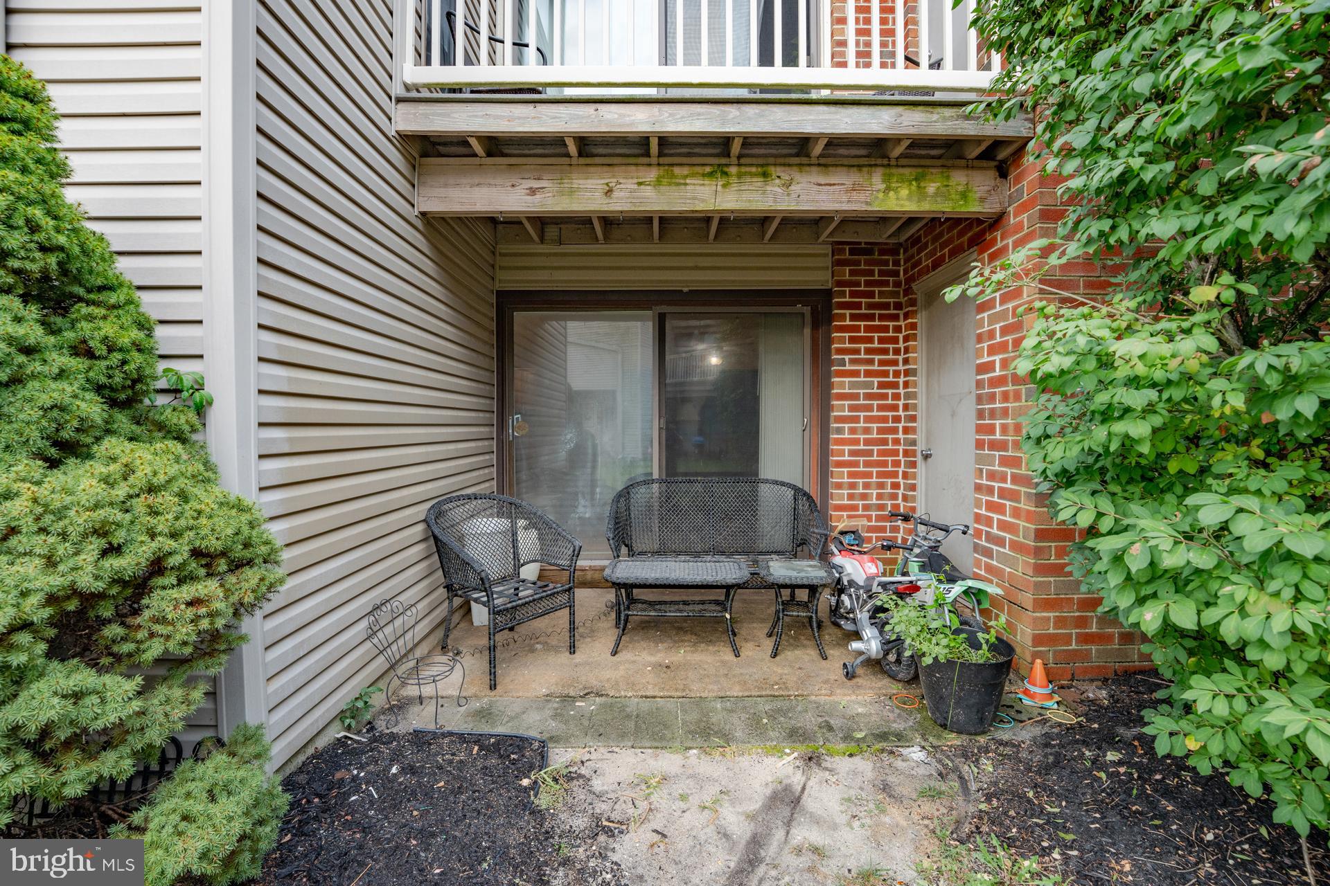 254 Vail Court, Unit 1504 Mays Landing, NJ 08330 - Photo 20 of 22 a view of house with outdoor seating space and potted plants
