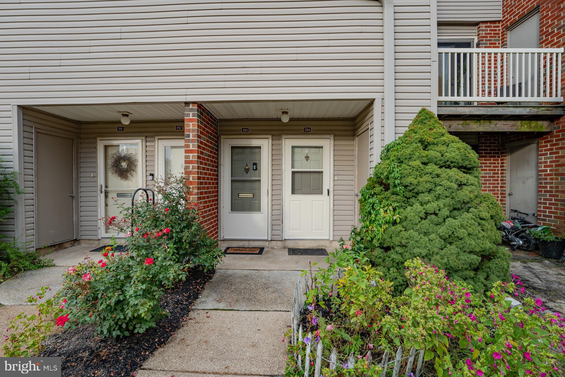254 Vail Court, Unit 1504 Mays Landing, NJ 08330 - Photo 3 of 22 a front view of a house with plants