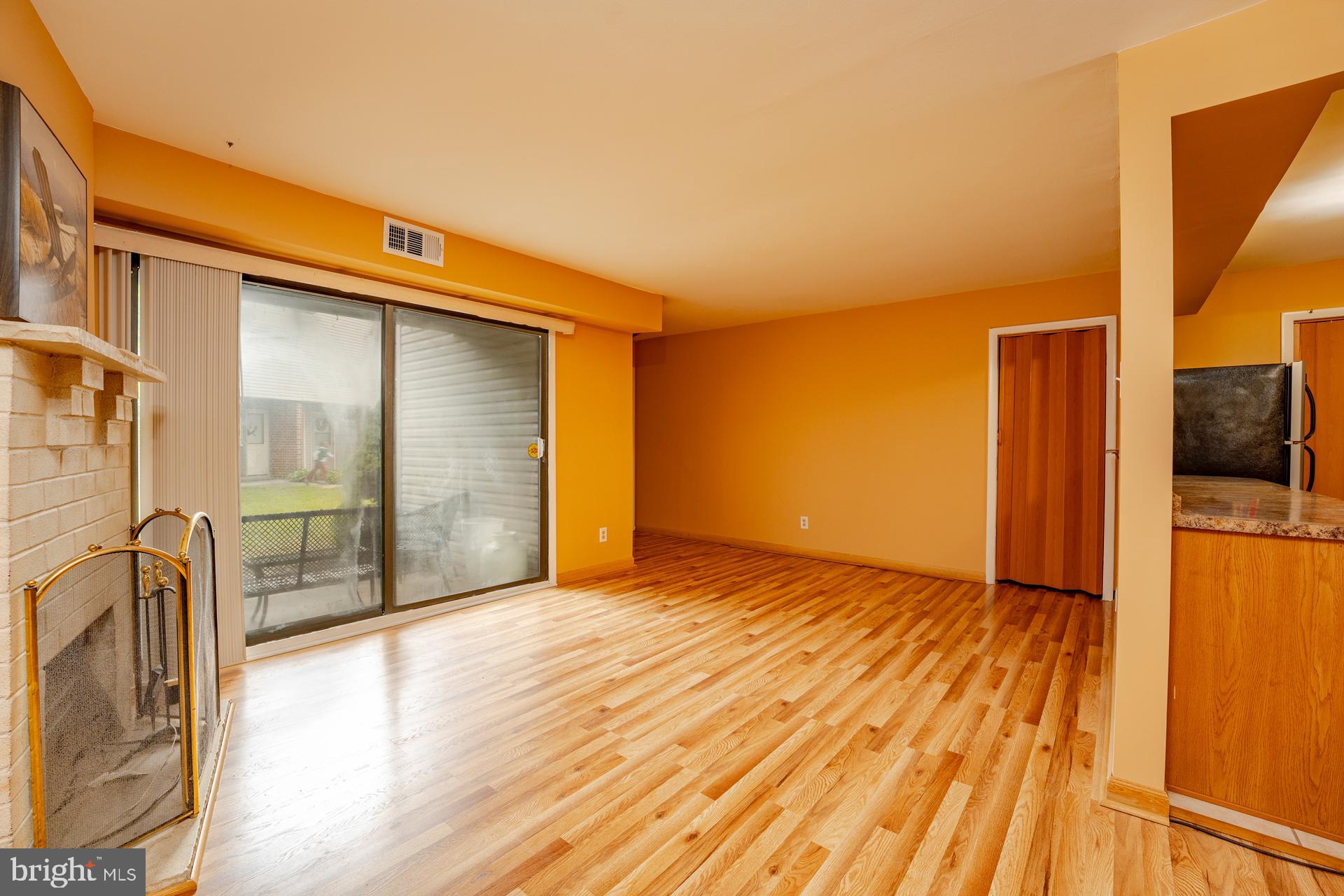 254 Vail Court, Unit 1504 Mays Landing, NJ 08330 - Photo 4 of 22 a view of empty room with wooden floor