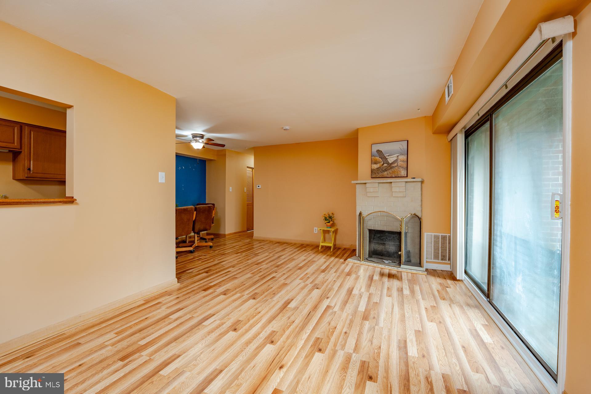 254 Vail Court, Unit 1504 Mays Landing, NJ 08330 - Photo 5 of 22 a view of a livingroom with wooden floor and a fireplace