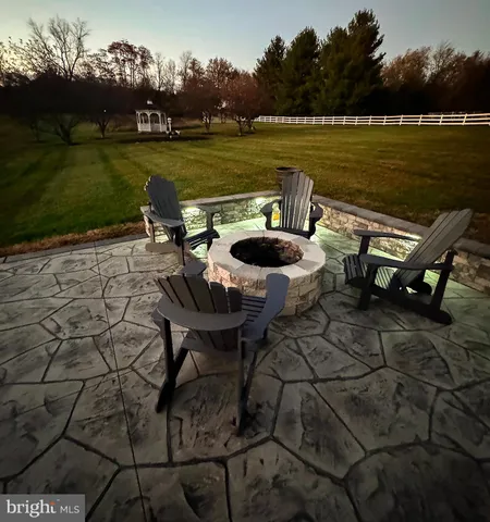 a living room with furniture a flat screen tv and a window