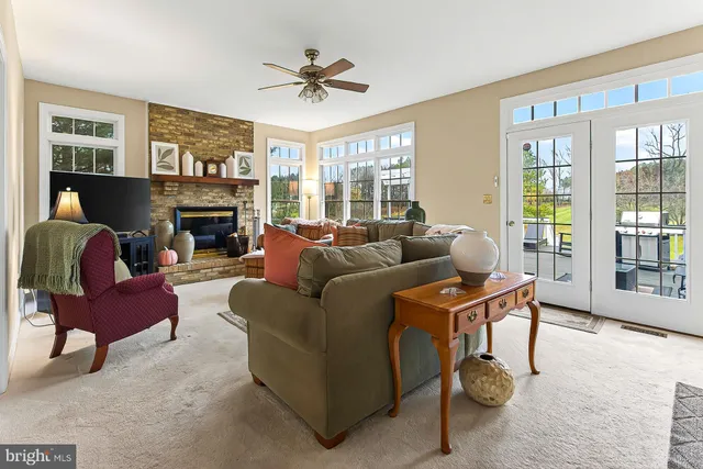 a view of a house with swimming pool and sitting area