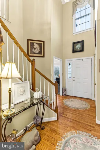 a living room with furniture a lamp and a fireplace