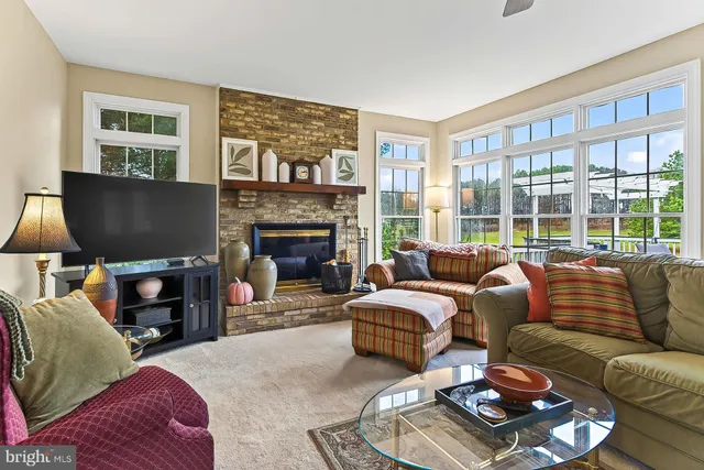 a front view of a building with a garden and plants