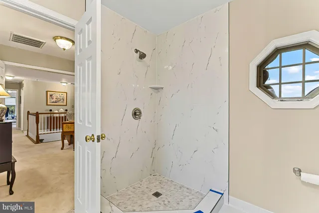 a view of a lake with outdoor seating