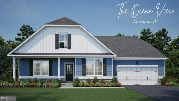 a front view of a house with a garden and plants