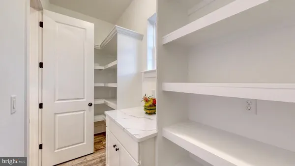 a utility room with cabinets washer and dryer