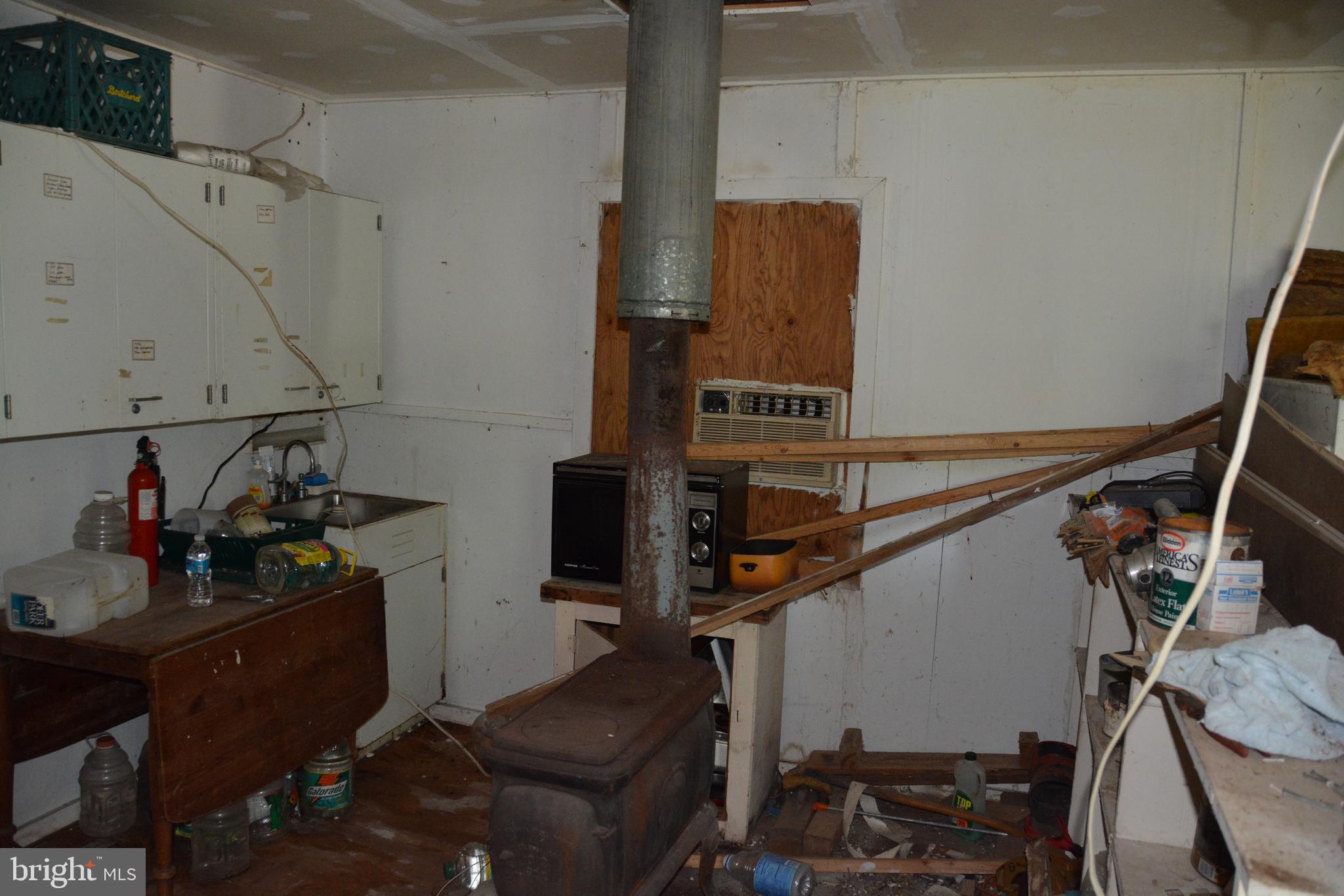 596 Back Creek Road Gore, VA 22637 - Photo 11 of 17 a storage room on top of refrigerator and stove