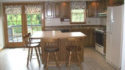 161 Highfield Road Rocky Mount, VA 24151 - Photo 6 of 8 a kitchen with a window a sink and a refrigerator