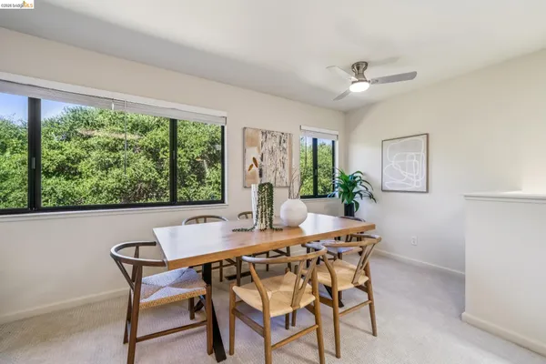 a view of a dining room with furniture window and outside view