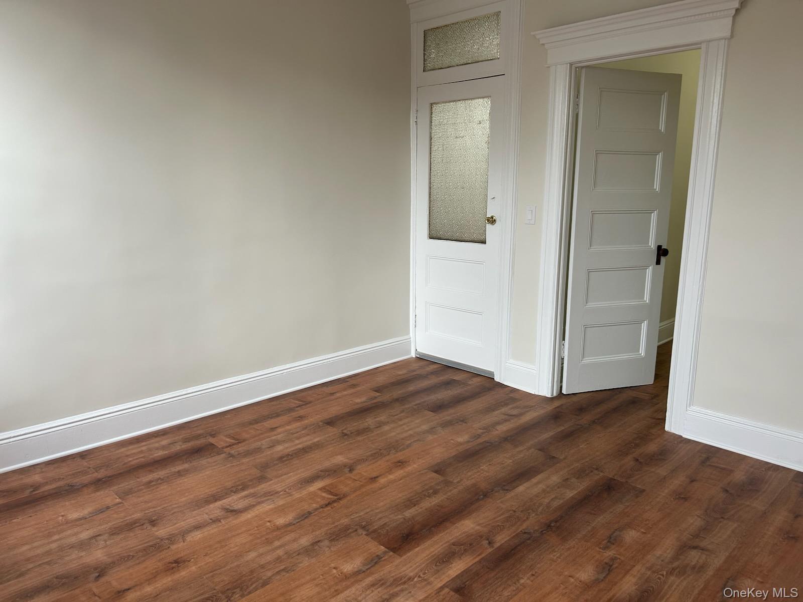 88-23 85th Street, Unit 2R Queens, NY 11421 - Photo 12 of 14 wooden floor in an empty room