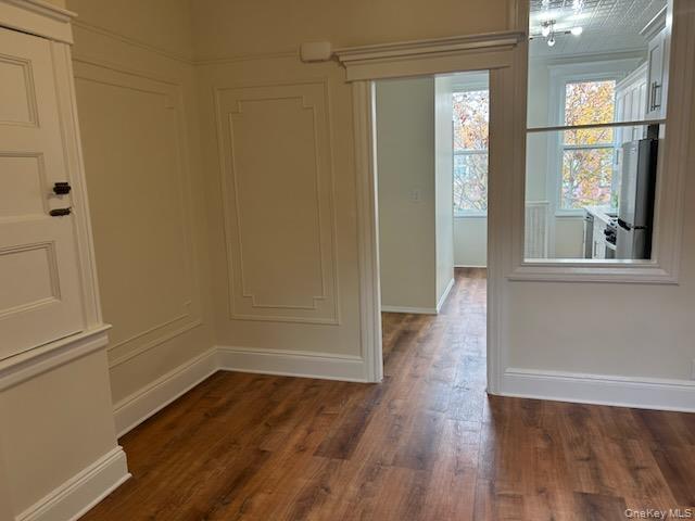 88-23 85th Street, Unit 2R Queens, NY 11421 - Photo 5 of 14 a view of a room with wooden floor and windows