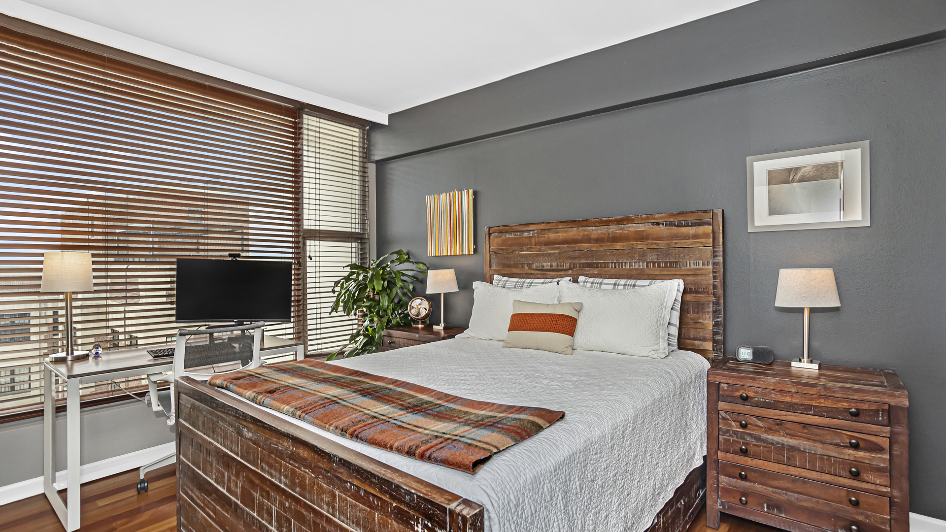 Undisclosed Address Chicago, IL 60657 - Photo 14 of 23 a bedroom with a bed and a flat screen tv