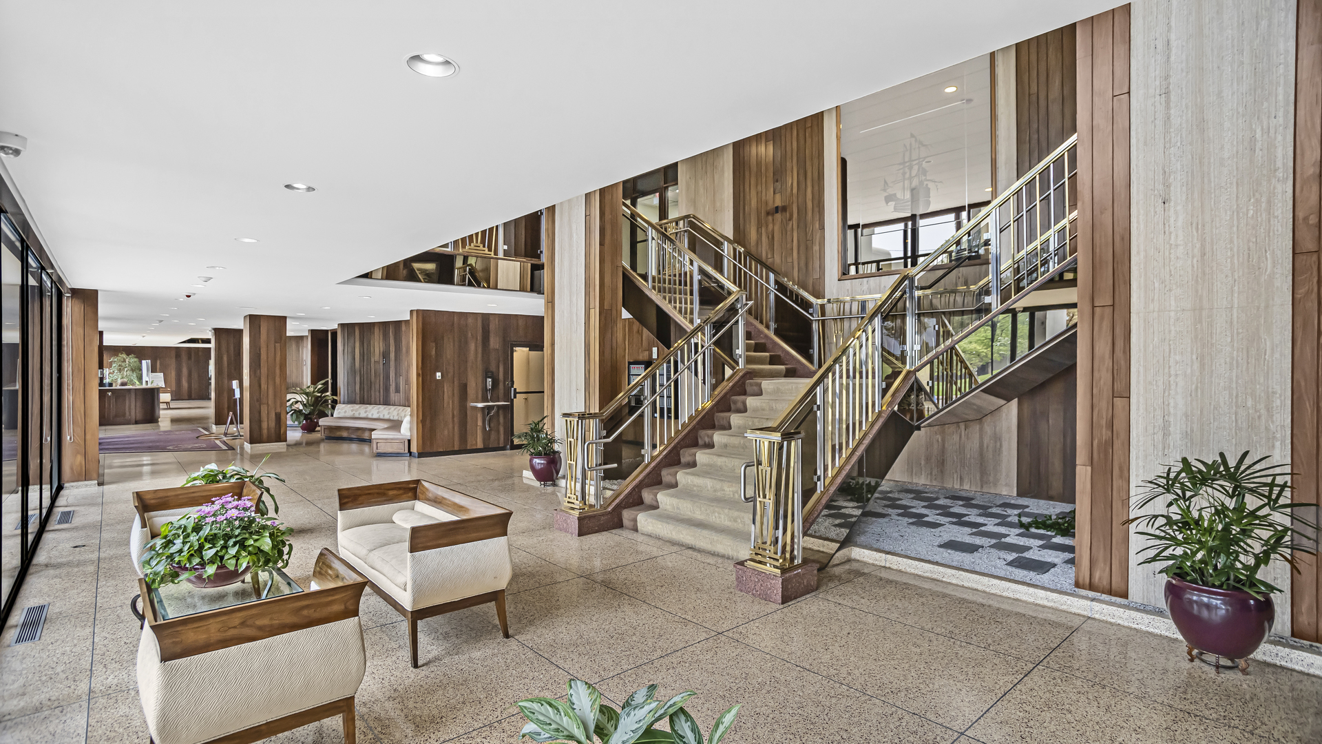 Undisclosed Address Chicago, IL 60657 - Photo 20 of 23 a living room with couches and potted plants with wooden floor