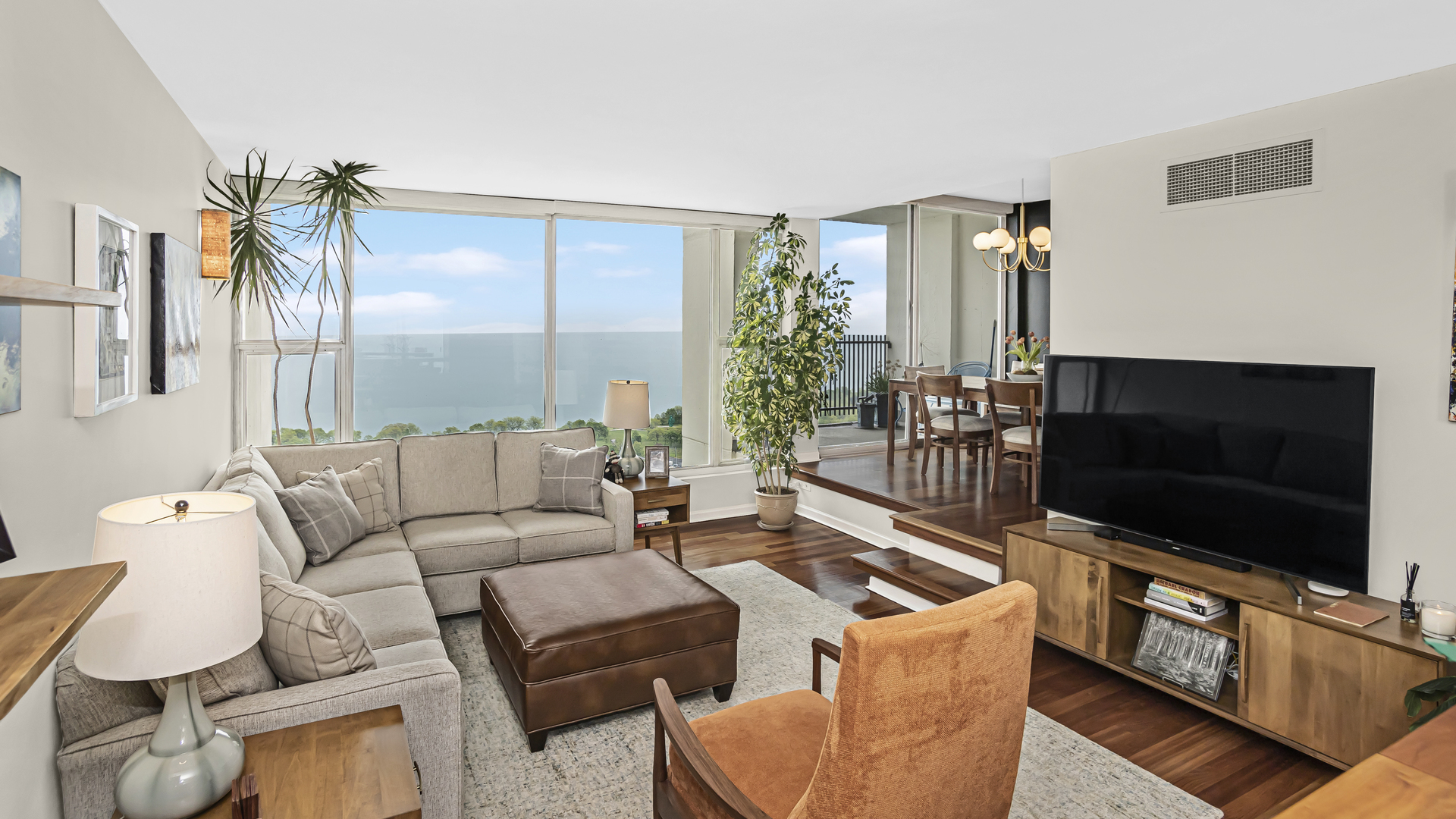 Undisclosed Address Chicago, IL 60657 - Photo 2 of 23 a living room with furniture and a flat screen tv