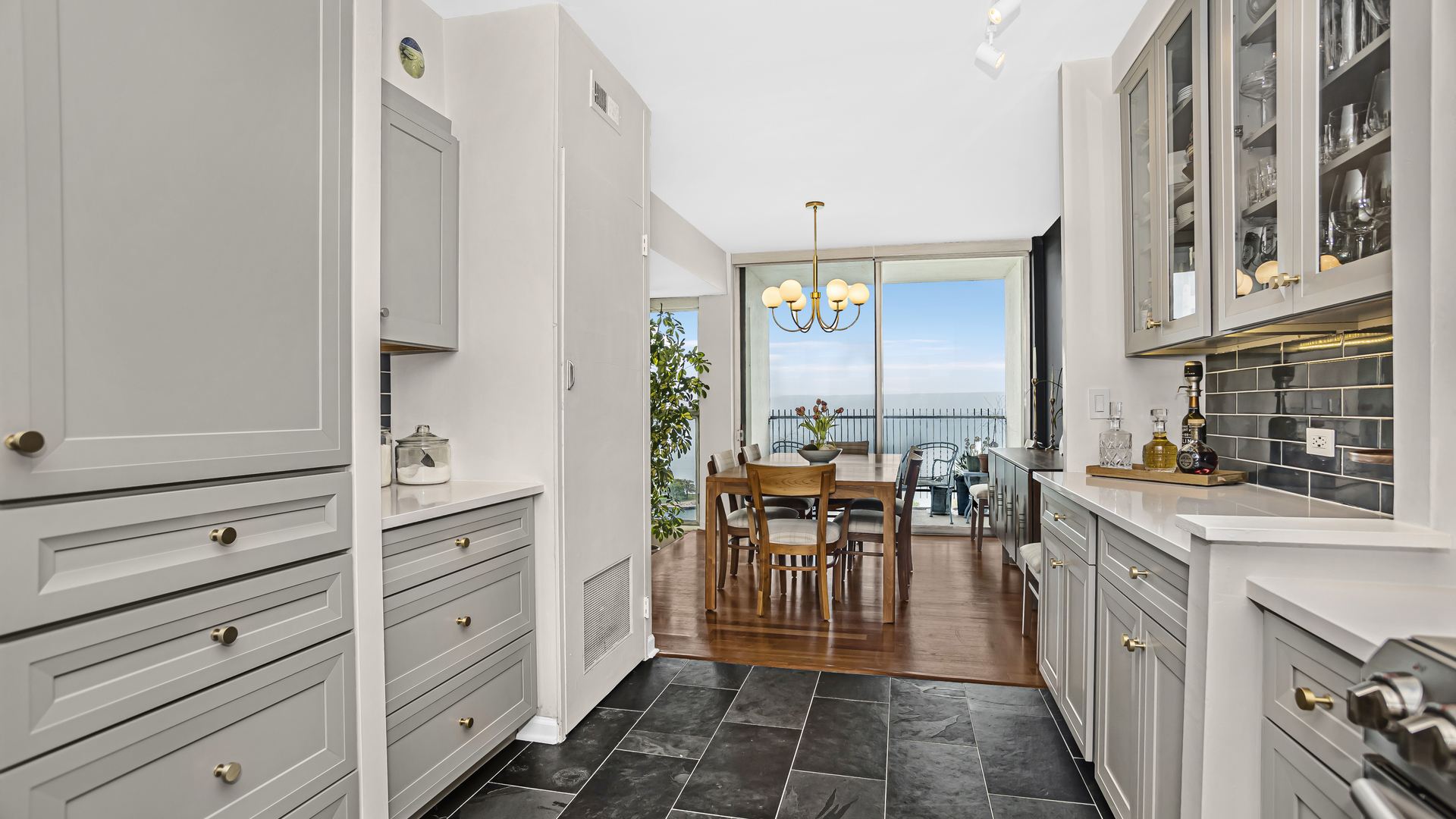 Undisclosed Address Chicago, IL 60657 - Photo 8 of 23 a kitchen with granite countertop cabinets and furniture