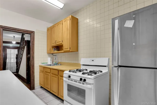 a kitchen with a stove and a refrigerator