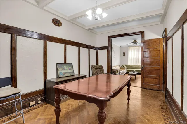 a dining room with furniture and window