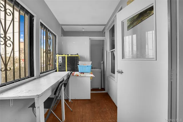 a view of a dining room with furniture and wooden floor